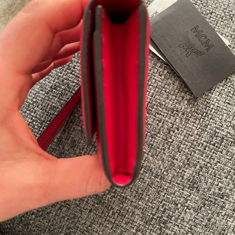 Women MCM leather wristlet cards wallet.